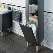 VitrA Sento tall bathroom cabinet with bottom drawer open showing integrated laundry basket